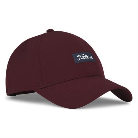 The Titleist Charleston Breezer Cap in Burgundy/Navy/White features a curved brim and logo patch, offering breathable comfort on and off the course.