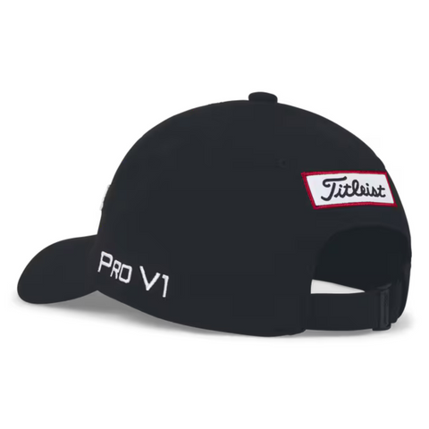The Titleist Junior Tour Performance Cap in black features a Titleist patch above the back opening and white PRO V1 embroidery on the side. This adjustable kids golf hat from Titleist ensures a comfortable fit for young golfers.