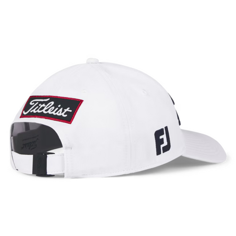 The Titleist Junior Tour Performance Cap is a white kids’ golf hat with a black Titleist patch, red border, adjustable black strap, and side FJ logo—combining classic style and function for young golfers.