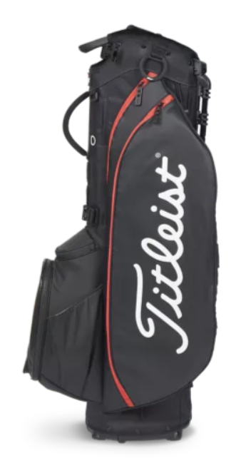 The Titleist Players 5 Stand Bag in black with white logo and red trim stands upright, showcasing several zippered pockets and compartments—a premium golf bag by Titleist for dedicated players.
