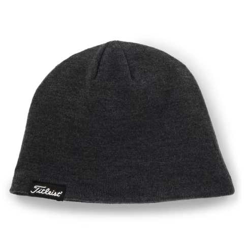 The Titleist Players Beanie is a plain dark gray knit hat with a small black and white Titleist logo tag, ideal for keeping warm on chilly golf days.