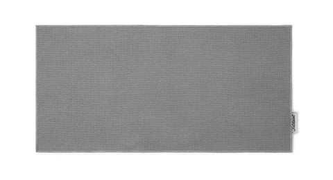 The Titleist Players Microfibre Towel by Titleist is a rectangular grey golf towel with a subtle texture and a small white tag on the right edge, shown laid flat on a white background.