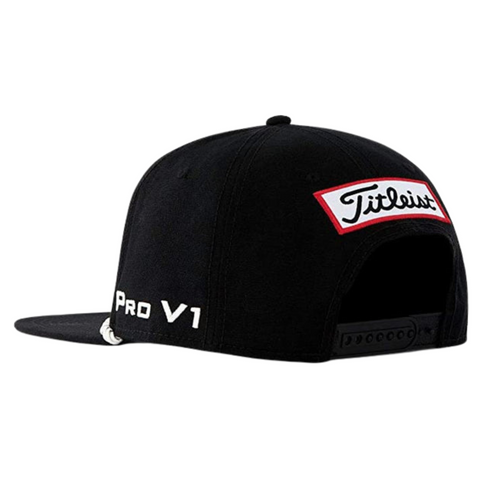 The Titleist Tour Rope Flat Bill Cap in black features a red and white Titleist logo patch on the back and white Pro V1 embroidery on the side, making it the ideal flat bill golf hat for fans of the Titleist brand.