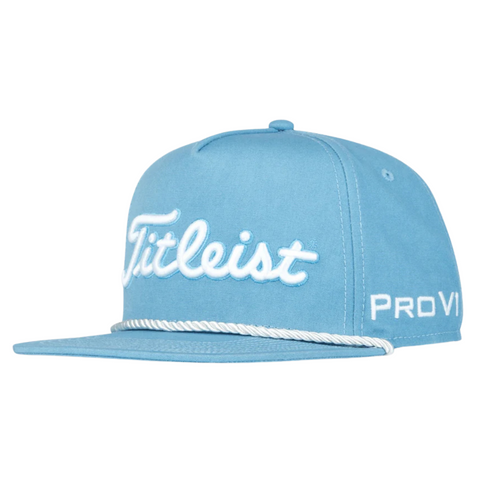 The Titleist Tour Rope Flat Bill Cap is a light blue flat bill golf hat featuring white Titleist embroidery on the front, Pro V1 text on the side, and a classic white rope trim above the brim—ideal for any golf enthusiast.