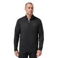 A man with short hair and a trimmed beard wears the TravisMathew Heater Pro 1/4 Zip Men’s Pullover in black, paired with black pants, standing against a plain white background.
