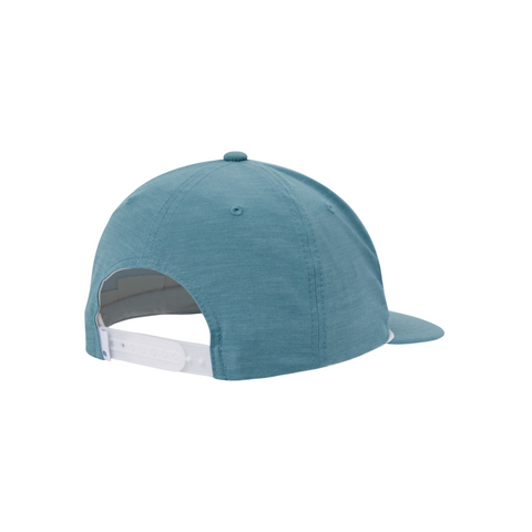 The Travis Mathew Hidden Agenda Snapback Cap in teal is shown from the back, displaying a white adjustable closure and a slightly curved brim against a white background.