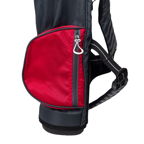 A close-up of a black and red fabric backpack with a zippered side pocket and adjustable shoulder straps, perfect for carrying lightweight golf clubs or the US Kids UL39 Junior Golf Package Set to the course.