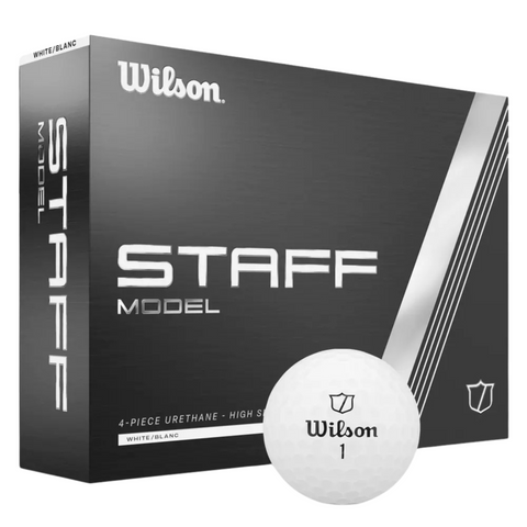 A box of Wilson 2024 Staff Model Golf Balls by Wilson, designed for tour performance, with a white ball in front displaying the Wilson logo and number 1. The black box has bold white text and sleek silver accents.