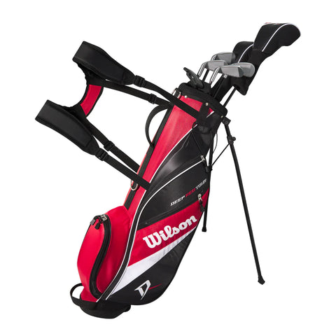 A red, black, and white Wilson golf bag with shoulder straps stands on its built-in legs, holding several clubs from the Wilson 2025 Deep Red Junior Set (12-14 Years).