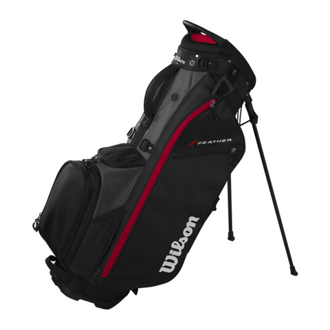 The Wilson 2025 Feather Stand Bag, an ultra-lightweight black golf bag with red accents and the Wilson logo, features extended legs and multiple zippered compartments—ideal for golfers who prefer walking the course.