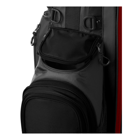 Close-up of the Wilson 2025 Feather Stand Bag by Wilson in black and gray, highlighting a walkers pocket with a partially open zipper, textured fabric, and several attachment loops and clips.