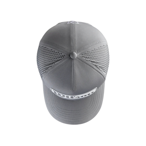 The Wilson 2025 Golf Performance Cap, designed by Wilson, features a perforated back panel for ventilation, a rectangular logo patch on the front, a breathable rounded crown, and a curved visor.