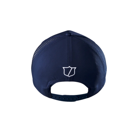 The Wilson 2025 Golf Performance Cap in navy features a white embroidered shield logo on the back, mesh side panels for breathability, and an adjustable snapback closure.