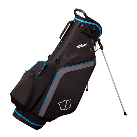 The Wilson Lite Carry Bag in Black/Charcoal/Blue by Wilson features multiple zippered pockets and extended silver legs for standing support, offering lightweight comfort and convenience on the golf course.