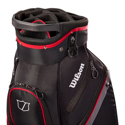 The Wilson Lite Cart Bag in Black/Charcoal/Red features multiple zippered pockets, a convenient top handle, organized club dividers, and a subtle shield logo. Lightweight and textured, it’s perfect for golf enthusiasts.