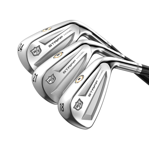 Three Wilson Men's Staff Model Utility Irons (prior generation) overlap in a row, showing numbers 24, 21, and 18 on their polished soles, each with black shafts and tungsten weighting for enhanced performance.