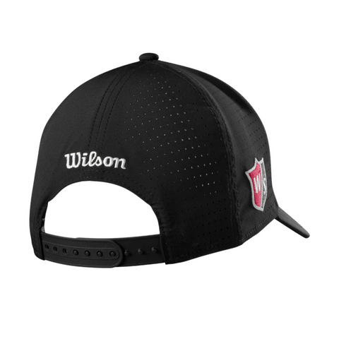 Wilson Performance Mesh Cap, shown from the back, features breathable material, an adjustable snapback strap with Wilson embroidered in white, and a red-and-white Wilson logo patch on the side.