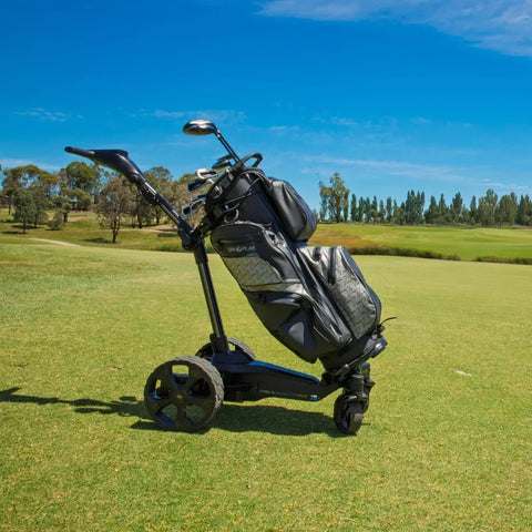 MGI Halo Electric Golf Trundler on a golf course with a blue sky background