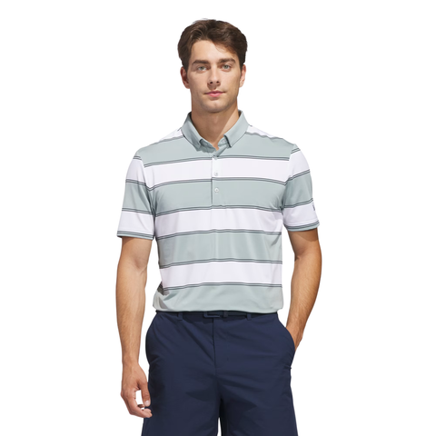 Men's Adidas golf polo featuring a striped design in light blue, white, and grey, paired with navy golf shorts for breathable comfort and modern on-course style.
