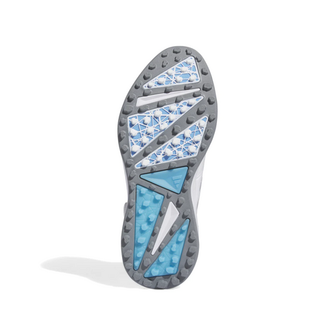 The image displays the sole of the Adidas 2024 Men’s Solarmotion BOA Spikeless Golf Shoes in White/Silver, featuring a gray base with blue and white geometric patterns, raised grip sections, triangular segments, and textured traction areas.