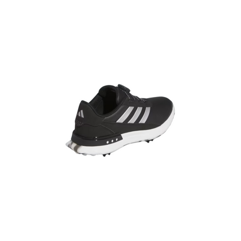 The Adidas Women's S2G BOA 24 Golf Shoes in black with white stripes and a white sole, shown from the back-left against a plain background, offer women stylish, comfortable, and spikeless footwear for golf.