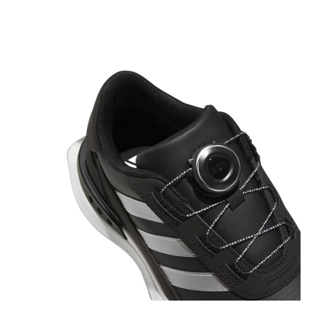 The Adidas Women's S2G BOA 24 Golf Shoes are black with white stripes and feature a round-dial quick-lacing system. These stylish, spikeless golf shoes by Adidas are shown on a white background.
