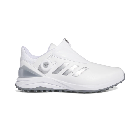 The Adidas 2024 Men’s Solarmotion BOA Spikeless Golf Shoe in White/Silver features a gray sole, silver accents, and a side BOA Fit System dial, shown in profile view facing right.