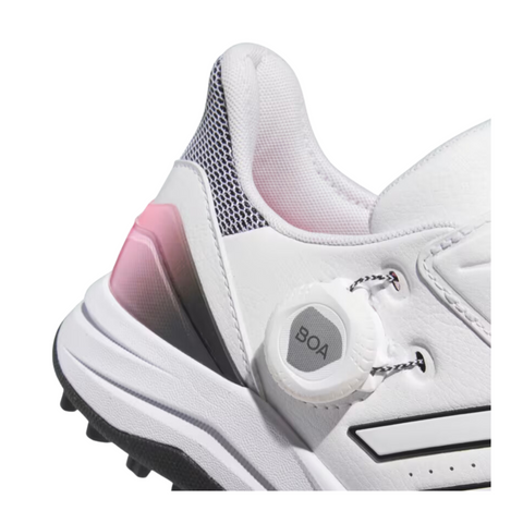 Close-up of the Adidas 2024 Women's Solarmotion BOA Golf Shoes, showing a textured spikeless sole, mesh heel detail, pink gradient accent, and side BOA Fit System dial lacing.
