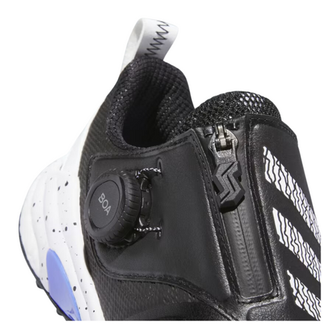 Close-up of the Adidas 2025 Women's Codechaos Boa Spikeless Golf Shoes in Black/White/Cobalt Blue, featuring a BOA Fit System dial, zipper, white and blue accents, speckled midsole, and bold diagonal stripes.