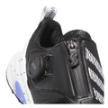 Close-up of the Adidas Codechaos Boa 25 Spikeless Womens Golf Shoe in black featuring a zipper, round Boa Fit System dial, white zigzag stripes, a speckled white midsole, and a blue accent on the side.
