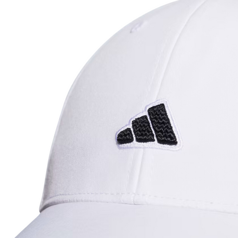 Close-up of the Adidas Womens Logo Patch Cap—a stylish white golf cap with a black and white logo patch, curved brim, visible seams, and AEROREADY technology for moisture management by Adidas.