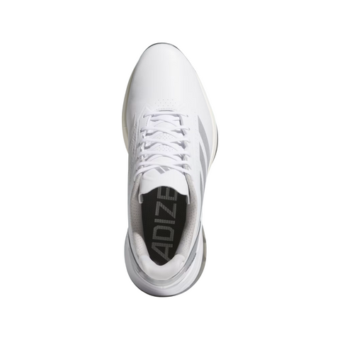 Top view of Adidas Men's Adizero ZG Spikeless Golf Shoes in White/Grey, featuring white laces, grey side stripes, and ADIZERO text on the insole, set against a white background.
