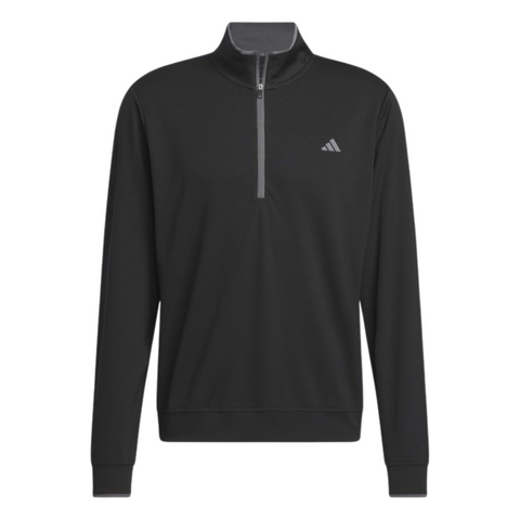 Adidas Mens Core Lightweight Zip Top in black with a quarter-zip closure and small white chest logo, shown on a plain white background. This breathable, lightweight golf top is an ideal outer layer for versatile comfort on the course.