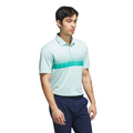 A man stands against a white background wearing the Adidas Mens Performance Chest Stripe Print Polo Shirt in Flash Aqua, a light blue and green gradient golf polo with moisture-wicking fabric, paired with navy blue pants.