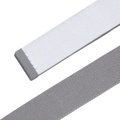 Two flat, woven straps—one white with a gray plastic end, one solid gray—are displayed diagonally on a white background, showcasing the practical style of the Adidas Men’s Reversible Webbing Belt in Grey/White.