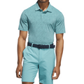 A man stands with his arms at his sides on a white background, wearing an Adidas Mens Ultimate365 Bunker Polo Shirt in Pure Teal, paired with light teal shorts and a dark belt.