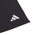 A close-up of the Adidas Players Towel in black, featuring a textured microfiber finish and a white embroidered Adidas logo in one corner, set against a white background.
