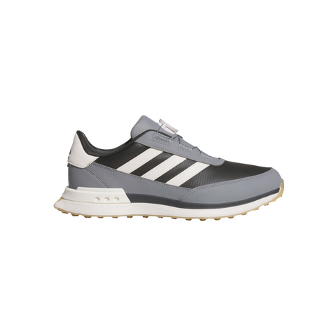 A side view of the Adidas S2G 24 BOA Men’s Golf Shoes in Carbon, Chalk White, and Grey Three shows three white stripes, a white heel detail, and a textured beige sole. This spikeless Adidas golf shoe is set against a plain white background.