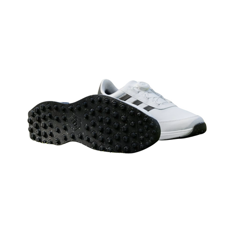 Adidas S2G BOA 24 Wide Spikeless Mens Golf Shoes in Cloud White/Core Black feature black stripes, a sleek design, and numerous small cleats on the black soles, shown from side and bottom views.