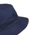 Close-up of the Adidas Solid Bucket Hat | Collegiate Navy by Adidas, showcasing its textured fabric and fine stitching. This stylish golf hat provides dependable sun protection, set against a white background.