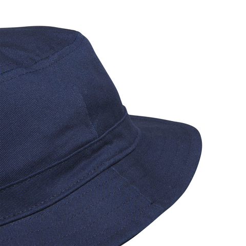Close-up of the Adidas Solid Bucket Hat | Collegiate Navy by Adidas, showcasing its textured fabric and fine stitching. This stylish golf hat provides dependable sun protection, set against a white background.