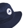 The Adidas Solid Bucket Hat in Collegiate Navy features a white patch with a blue triangular Adidas logo and THE BRAND WITH THE 3 STRIPES text. Stylish sun protection, perfect as a golf hat. Plain white background.