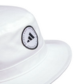 A close-up of the Adidas Solid Bucket Hat in Collegiate Navy, featuring a circular Adidas Golf patch on the front for style, with moisture-wicking comfort and sun protection.