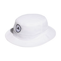 The Adidas Solid Bucket Hat in Collegiate Navy features a black and white circular logo patch with the Adidas symbol and text on the front. Designed for sun protection, its perfect for outdoor activities.