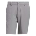 The Adidas Ultimate365 8.5" Men's Golf Shorts are light gray, lightweight, and slightly stretchy with belt loops, a front button closure, and zipper fly. They feature a smooth fabric and tailored design with no visible logos or patterns.