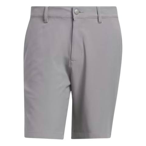 The Adidas Ultimate365 8.5" Men's Golf Shorts are light gray, lightweight, and slightly stretchy with belt loops, a front button closure, and zipper fly. They feature a smooth fabric and tailored design with no visible logos or patterns.