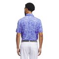 A man, seen from behind, wears an Adidas Ultimate365 Mesh Print Mens Polo (2XL only) in purple and white with white pants and a belt, posed against a plain white background.