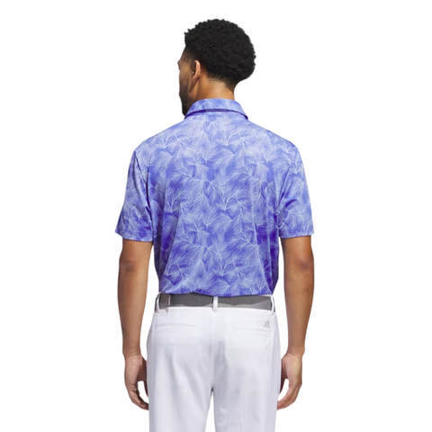 A man, seen from behind, wears an Adidas Ultimate365 Mesh Print Mens Polo (2XL only) in purple and white with white pants and a belt, posed against a plain white background.