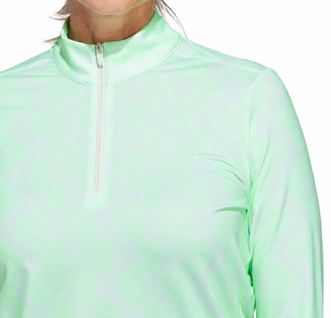A woman models the Adidas Women's Ultimate365 Printed Quarter-Zip Pullover in light green, featuring a high collar and zip front, shown from shoulders to chest against a plain background.