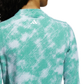 A person is shown from the back wearing an Adidas Ultimate365 Printed Quarter-Zip Long-Sleeve Polo Shirt in Pure Teal, with the Adidas logo visible near the collar.
